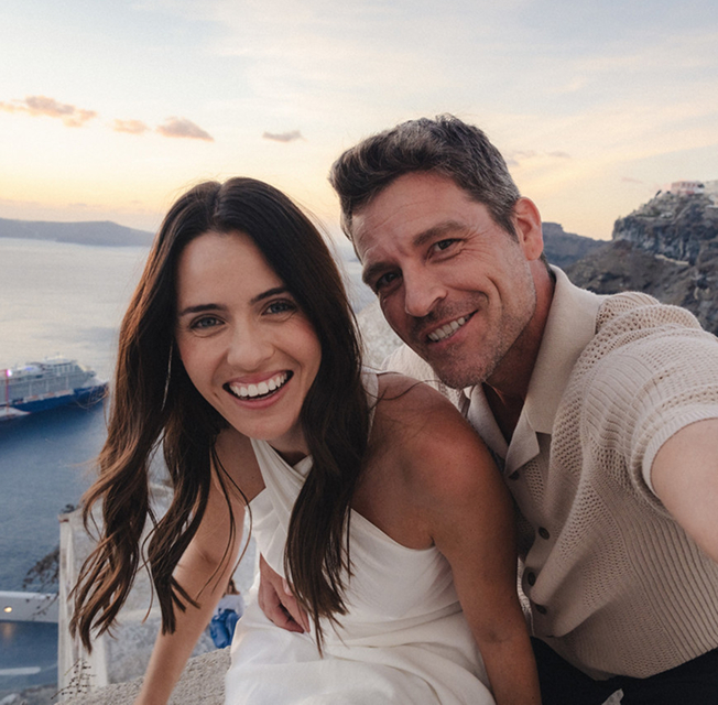 A picture of a couple enjoying a vacation in a coastal area