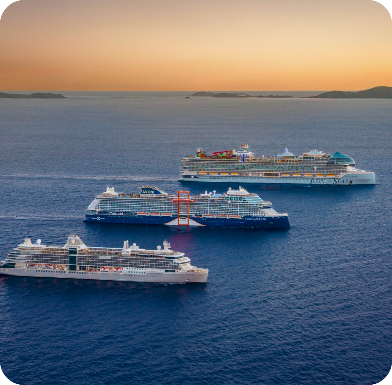 A fleet of three ships sail parallel to each other at sunset